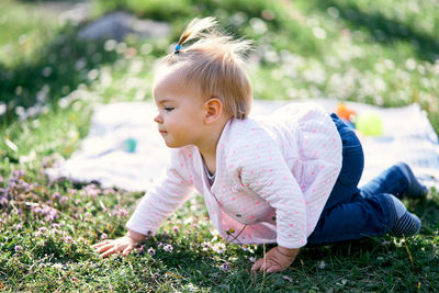 Full length of cute girl on field