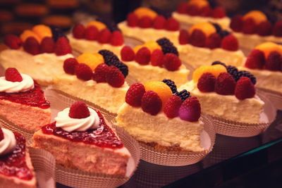 Close-up of cheesecake slices for sale on counter