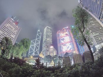 Low angle view of illuminated city against sky