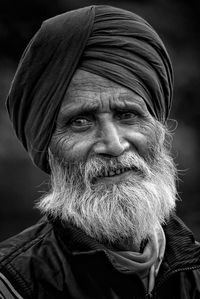 Close-up portrait of bearded man wearing turban