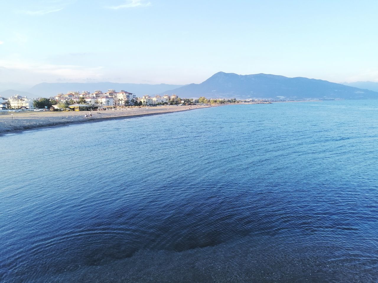 SCENIC VIEW OF SEA AND CITY AGAINST SKY