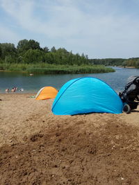 Tent on beach against sky