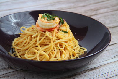 Close-up of noodles in bowl on table