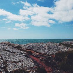 Scenic view of sea against cloudy sky