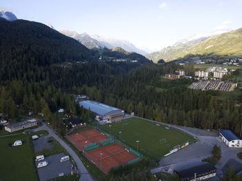 High angle view of buildings and mountains against sky