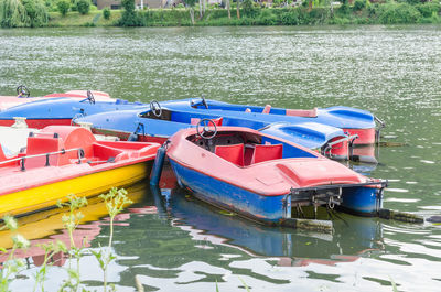 Boats moored in lake