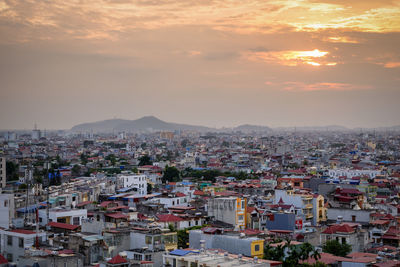 High angle view of townscape against sky during sunset