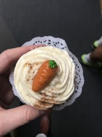 Midsection of person holding ice cream