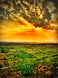 Scenic view of landscape against sky during sunset