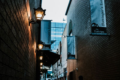 Low angle view of illuminated street light in city