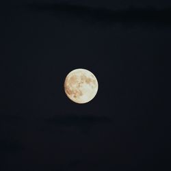 Low angle view of moon against sky at night