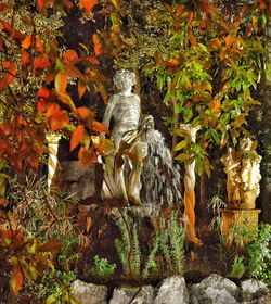 Statue amidst trees during autumn