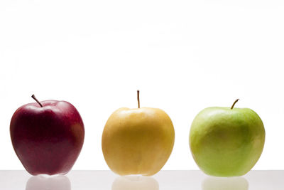 Close-up of apples on apple against white background