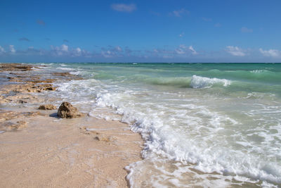 Scenic view of beach against sky