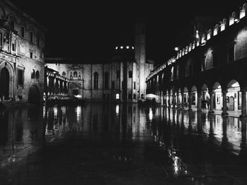 Reflection of illuminated built structure in water