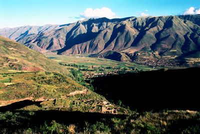 Scenic view of landscape and mountains against sky