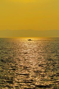 Scenic view of sea against clear sky during sunset