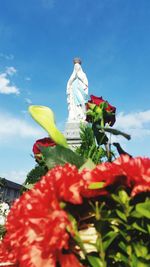 Low angle view of statue against sky