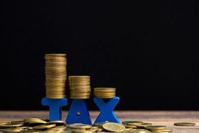 Stack of objects against black background