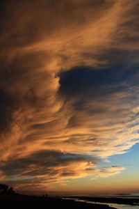 Scenic view of dramatic sky during sunset