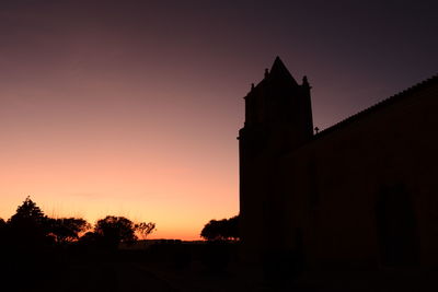 Silhouette of church at sunset