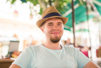 Portrait of young man wearing hat