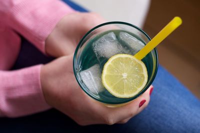 Close-up of hand holding drink