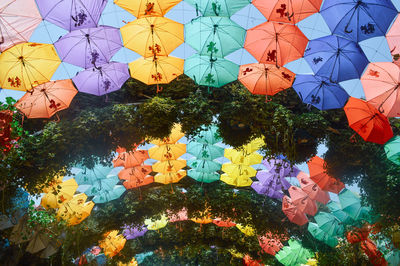 Low angle view of multi colored lanterns hanging against sky