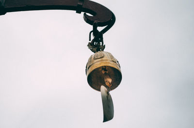 Low angle view of street light against sky