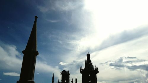 Low angle view of statue against cloudy sky