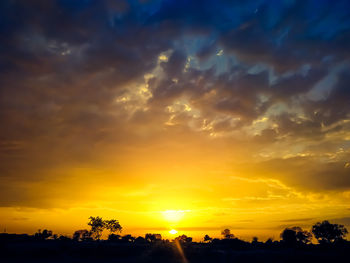 Scenic view of dramatic sky during sunset