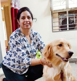 Portrait of smiling woman with dog