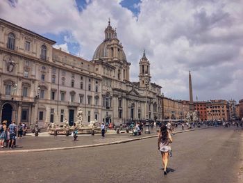 Tourists in front of historical building