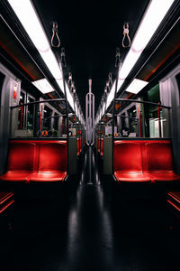 Train moving on illuminated railroad station at night