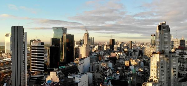 Aerial view of modern buildings in city against sky