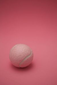 Close-up of apple against pink background