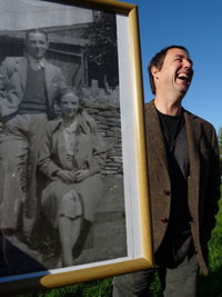 Portrait of smiling man standing outdoors