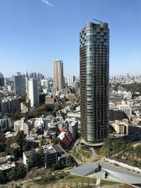 Modern buildings in city against clear sky