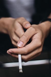 Close-up of man holding hands