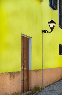 Yellow closed door of building