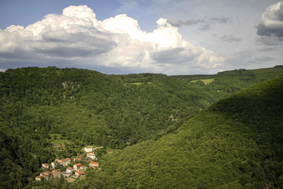 High angle view of trees and mountains against sky