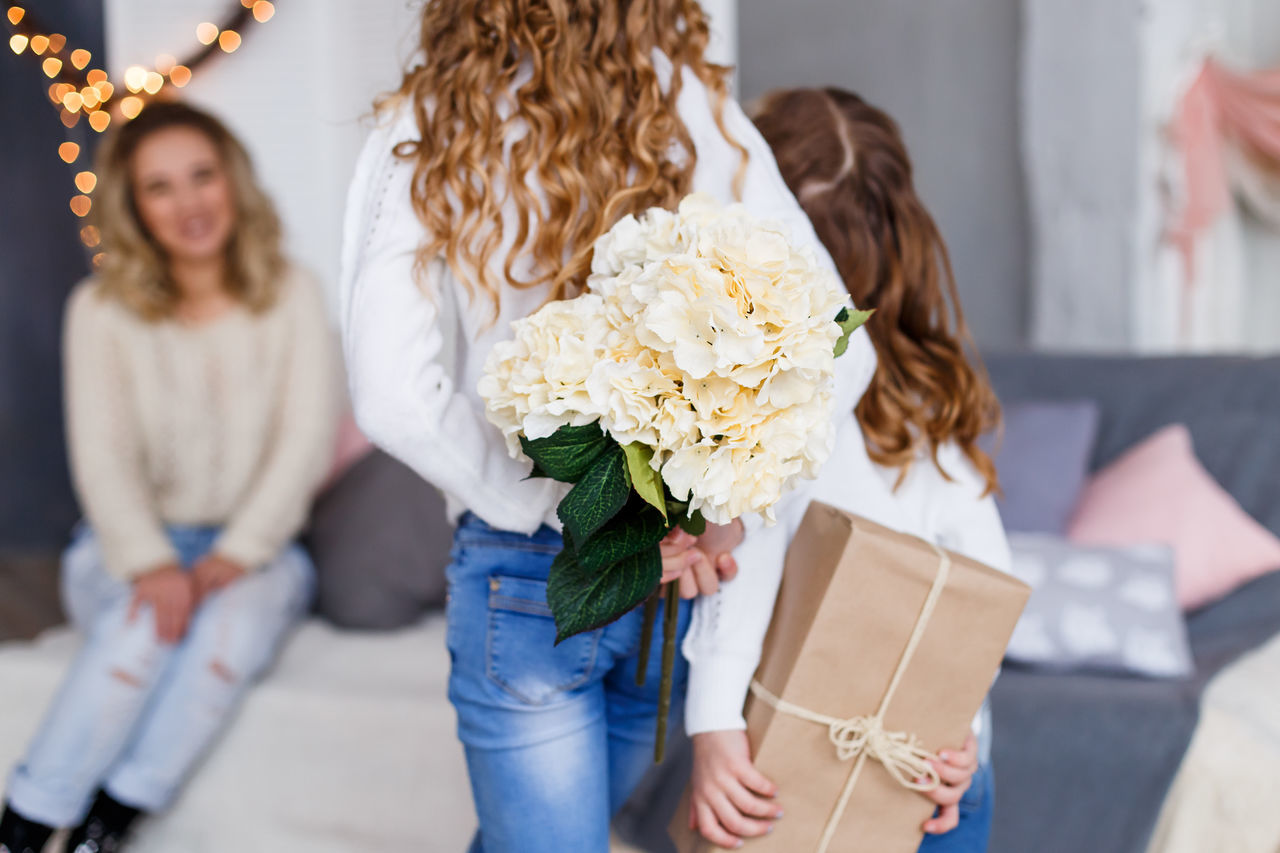 YOUNG WOMAN HOLDING BOUQUET