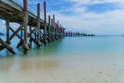 Pier over sea against sky