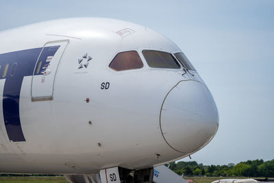 Low angle view of airplane against sky