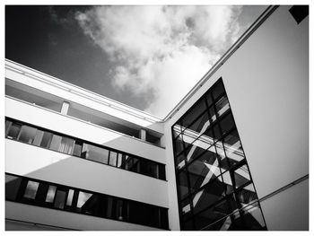 Low angle view of building against cloudy sky