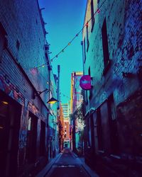 Low angle view of illuminated buildings in city