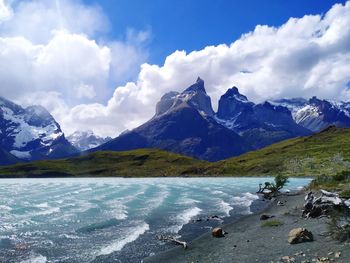 Scenic view of snowcapped mountains against sky