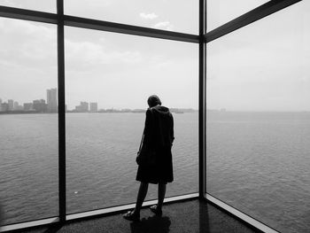 Rear view of woman looking at sea