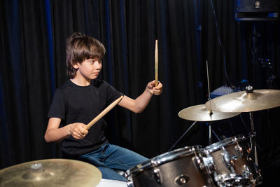 Boy playing drums