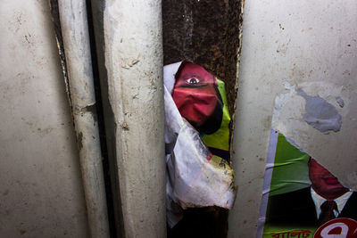 Close-up of torn posters on wall